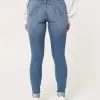 Jeans super skinny a vita alta con strappi e lavaggio medio