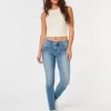 Jeans super skinny a vita bassa con lavaggio medio