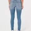 Jeans super skinny a vita bassa con lavaggio medio