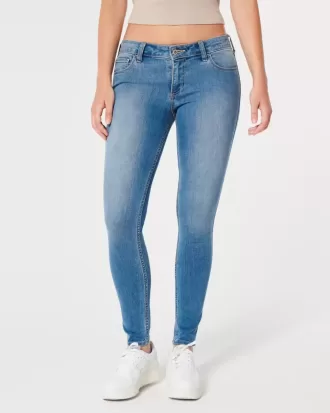 Jeans super skinny a vita bassa e lavaggio medio con effetto curvy