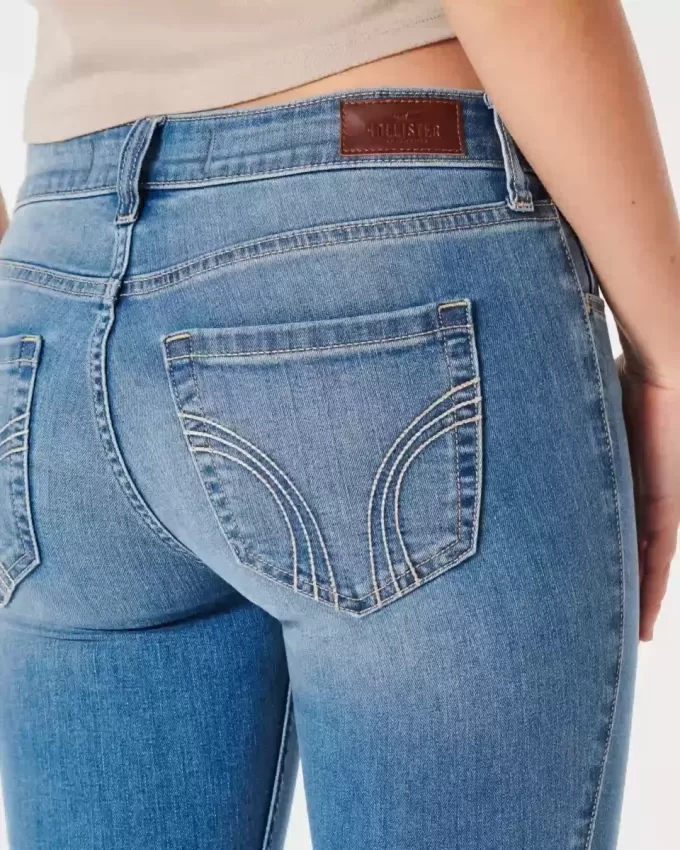 Jeans super skinny a vita bassa e lavaggio medio con effetto curvy