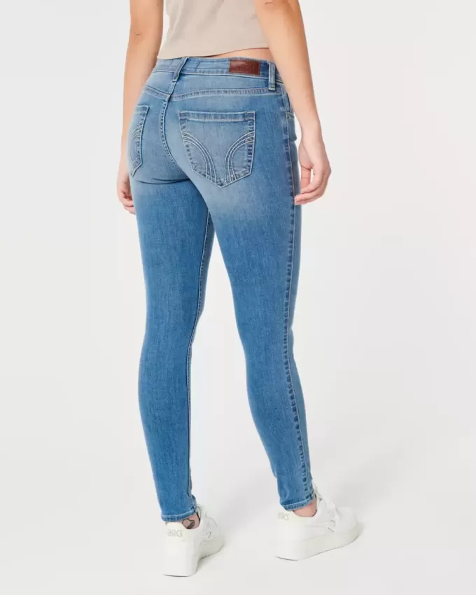 Jeans super skinny a vita bassa e lavaggio medio con effetto curvy