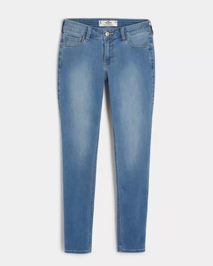 Jeans super skinny a vita bassa e lavaggio medio con effetto curvy