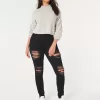 Jeans super skinny neri strappati a vita alta