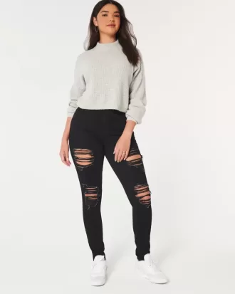 Jeans super skinny neri strappati a vita alta