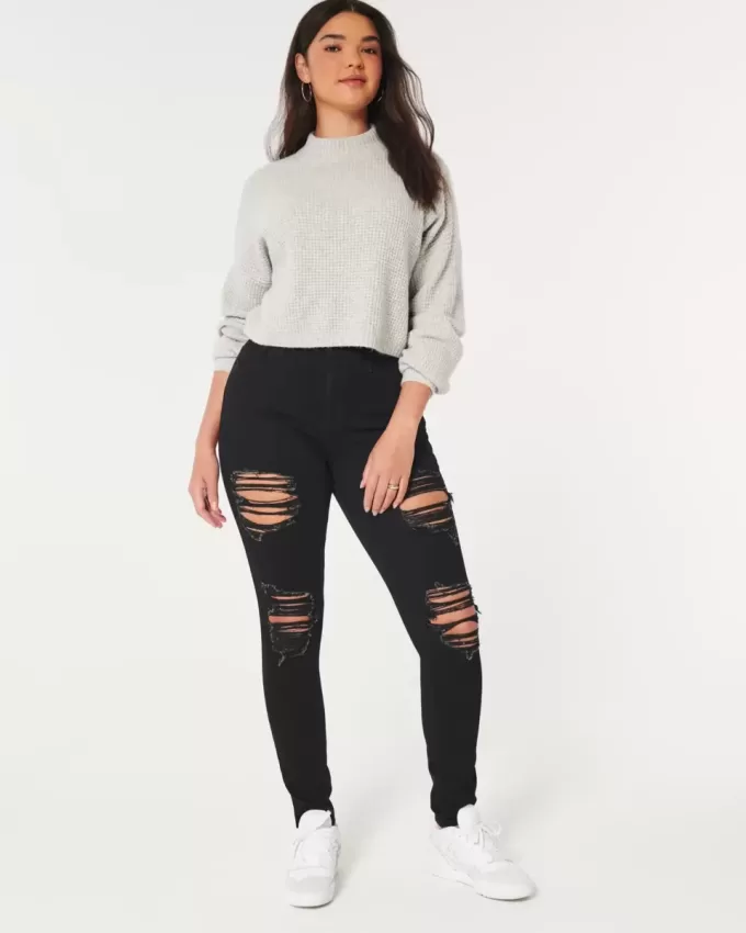 Jeans super skinny neri strappati a vita alta