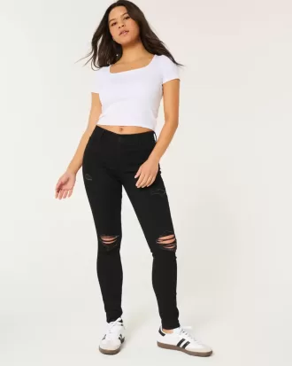 Jeans super skinny neri strappati a vita alta