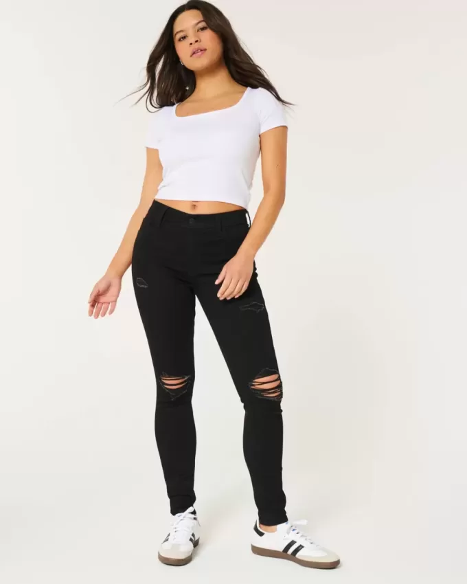 Jeans super skinny neri strappati a vita alta