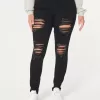Jeans super skinny neri strappati a vita alta
