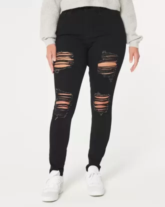 Jeans super skinny neri strappati a vita alta