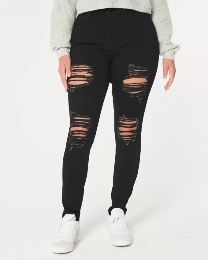 Jeans super skinny neri strappati a vita alta