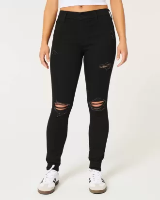 Jeans super skinny neri strappati a vita alta