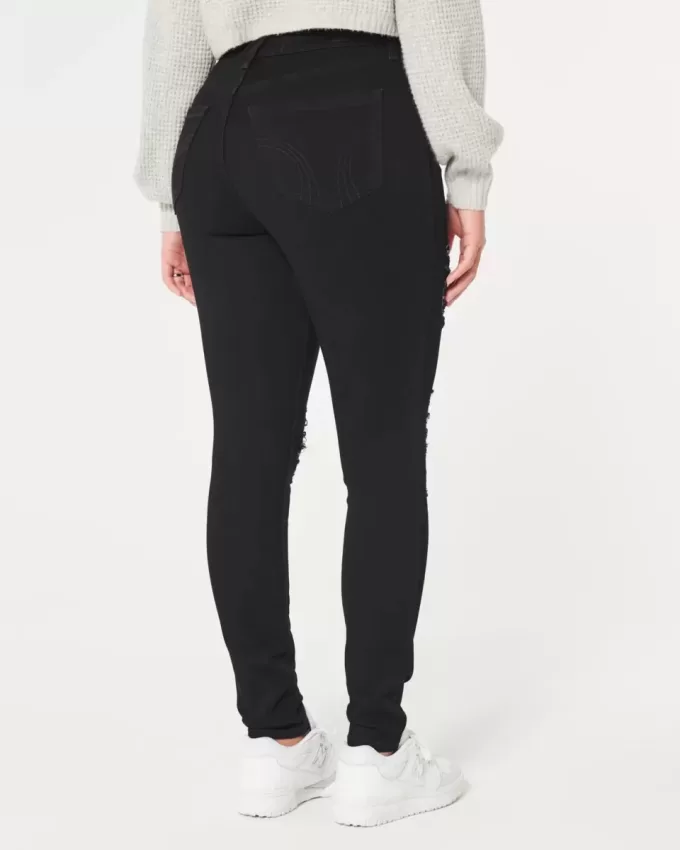 Jeans super skinny neri strappati a vita alta