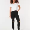 Leggings neri strappati a vita alta