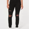 Leggings neri strappati a vita alta
