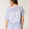 Maglia grafica oversize con spalle scoperte