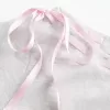 Maglietta con lacci e spalle scoperte