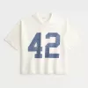 Maglietta da football con grafica Varsity, modello Baggy Crop e pesante