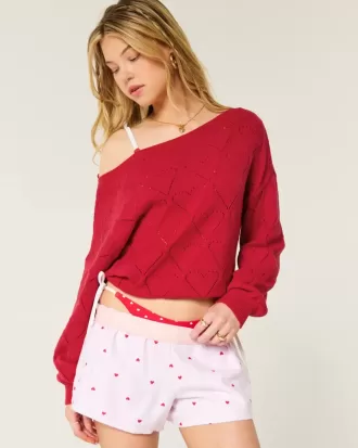 Maglione a spalle scoperte con motivo a cuore