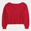 Maglione a spalle scoperte con motivo a cuore Maglione a spalle scoperte con motivo a cuore