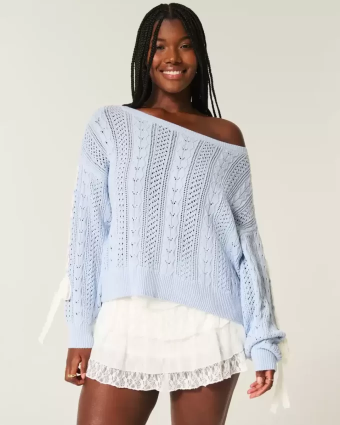 Maglione a trecce con maniche a fiocco