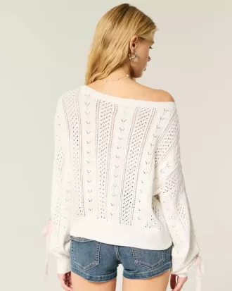 Maglione a trecce con maniche a fiocco
