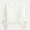 Maglione a trecce con maniche a fiocco Maglione a trecce con maniche a fiocco