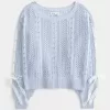 Maglione a trecce con maniche a fiocco