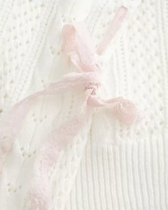 Maglione a trecce con maniche a fiocco Maglione a trecce con maniche a fiocco