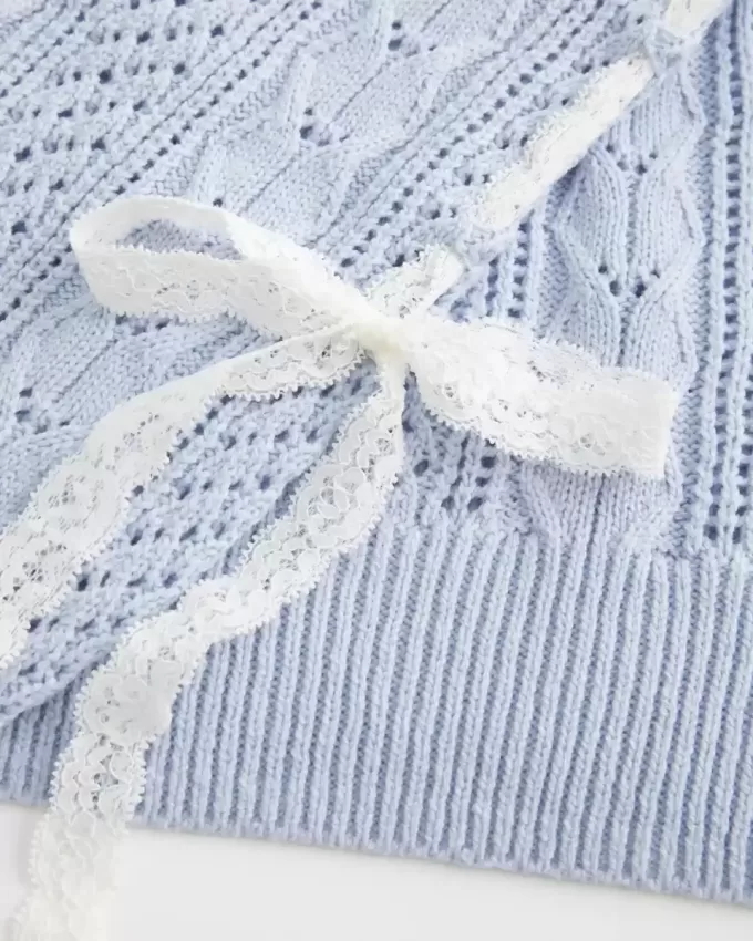 Maglione a trecce con maniche a fiocco