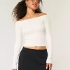 Maglione a trecce con spalle scoperte
