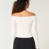 Maglione a trecce con spalle scoperte