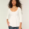 Maglione babydoll a trecce