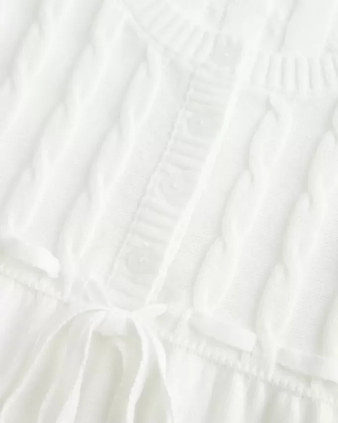 Maglione babydoll a trecce