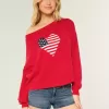 Maglione con bandiera a cuore e spalle scoperte Maglione con bandiera a cuore e spalle scoperte