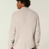 Maglione con cerniera e grafica numerica rilassata