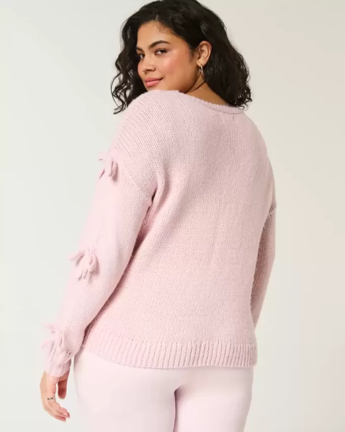 Maglione con fiocco applicato a spalle scoperte Maglione con fiocco applicato a spalle scoperte