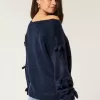 Maglione con fiocco applicato a spalle scoperte Maglione con fiocco applicato a spalle scoperte