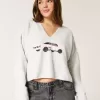 Maglione con scollo a V e grafica Hollister Comfy Cloud Maglione con scollo a V e grafica Hollister Comfy Cloud