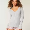 Maglione con scollo a V e lavorazione a trecce