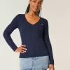 Maglione con scollo a V e lavorazione a trecce