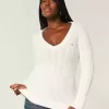 Maglione con scollo a V e lavorazione a trecce