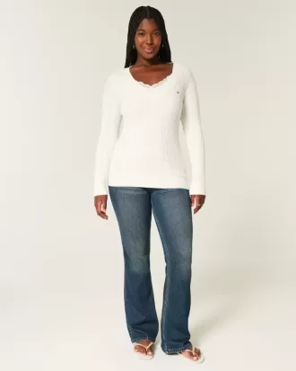 Maglione con scollo a V e lavorazione a trecce