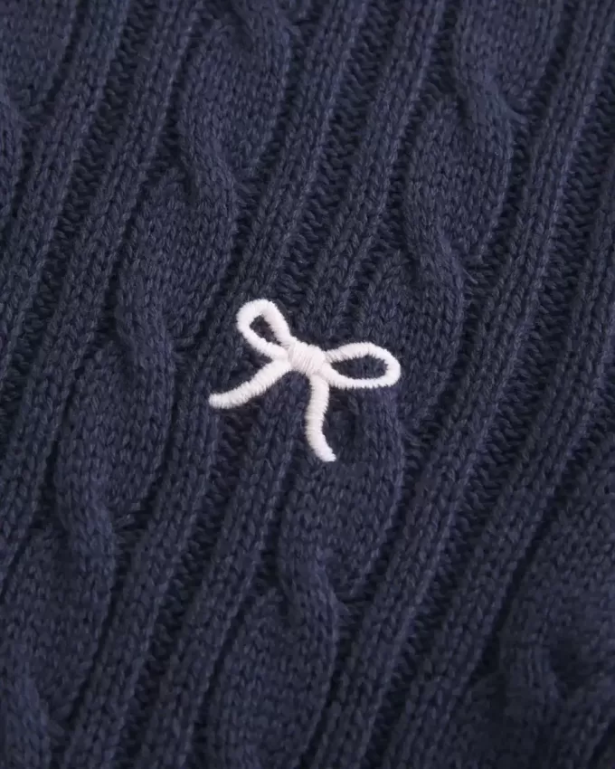 Maglione girocollo con fiocco in maglia a trecce