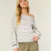 Maglione largo con spalle scoperte
