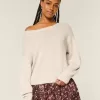 Maglione largo con spalle scoperte