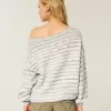 Maglione largo con spalle scoperte