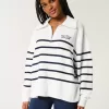 Maglione oversize con mezza zip e grafica