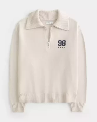 Maglione oversize con mezza zip e grafica