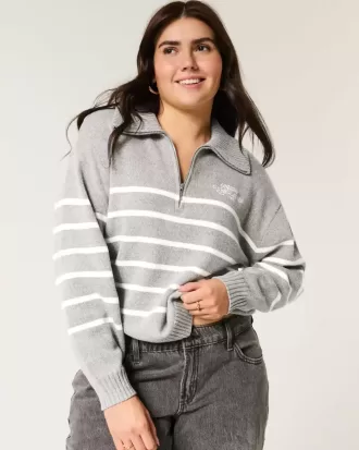 Maglione oversize con mezza zip e grafica
